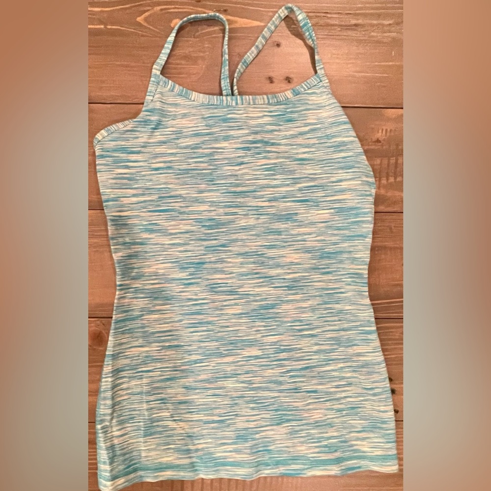 Ivivva by Lululemon tank top. Built in shelf bra. Great condition! Size 12.